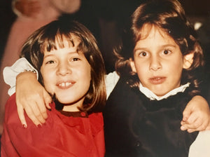 1982: Leah (l) rocking some red hot taffeta in an Elvis-inspired look do-up. Sam (r) frozen in time but oh-so avant in a black valour tuxedo twist